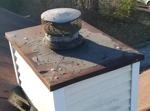 rusted chase top on chimney