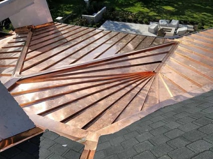 copper metal roof with asphalt shingles