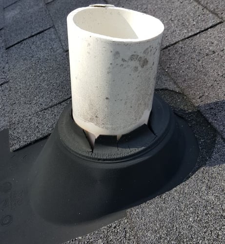 cracked neoprene pipe boot around a plumbing vent