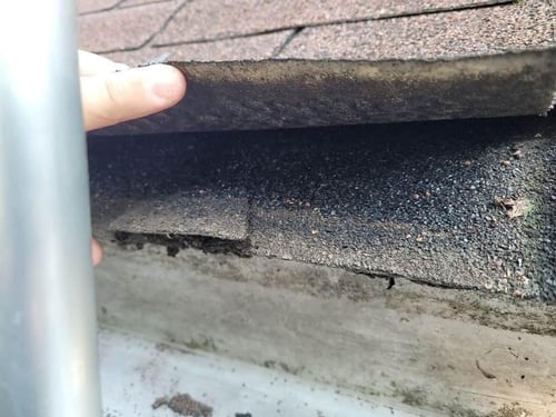 checking the number of layers currently on a roof during a roof inspection