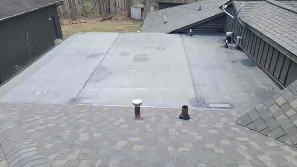 epdm membrane on flat roof area of an asphalt shingle roof