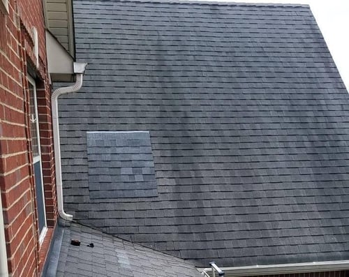 shingle taped on roof to show color difference