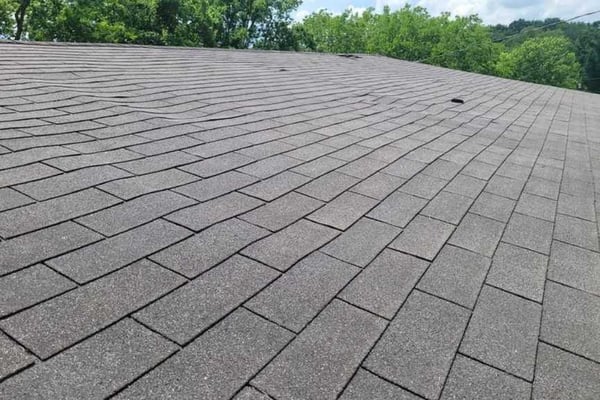 wavy roof from failing shingle roof