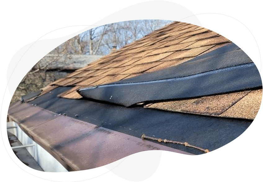 Wind damage to a asphalt shingle roof