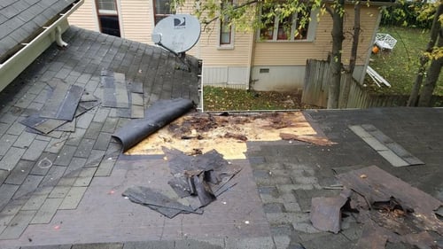 large roof repair with rotten decking and missing shingles