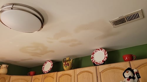 roof leak water spots on ceiling in kitchen