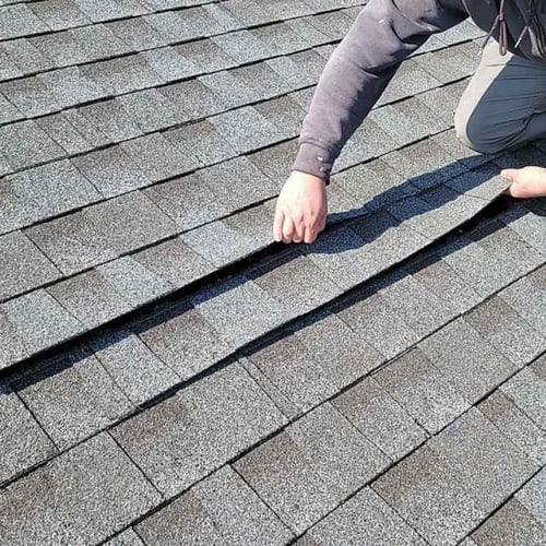 lifted architectural asphalt shingles caused by wind damage 