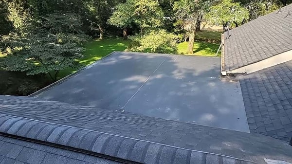flat section with epdm membrane on an architectural asphalt shingle roof