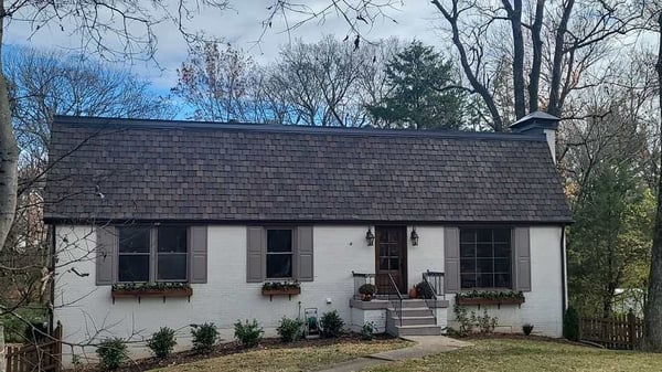 designer (also called luxury) asphalt shingle on a mansard roof