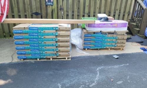 pallets with roofing materials delivered for a roof replacement 
