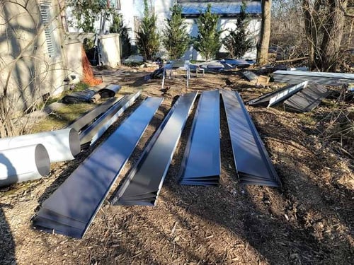 steel metal panels before installation begins on a standing seam metal roof