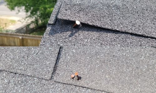 nails backing out through asphalt shingles