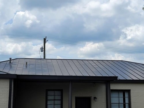 oil canning on a standing seam metal roof