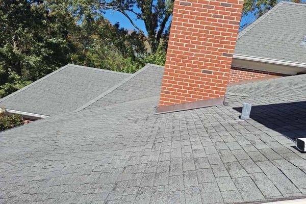 old asphalt shingle roof with extreme granular loss