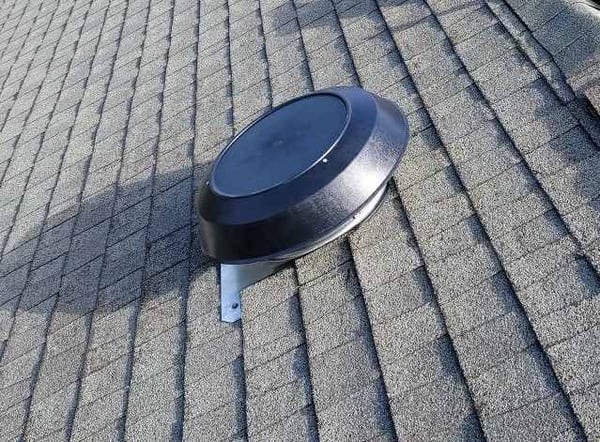 power roof vent on an architectural asphalt shingle roof