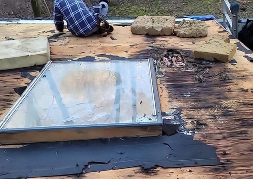 rotten roof decking around a skylight