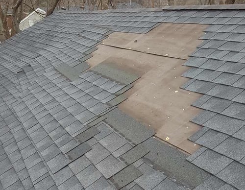 improperly installed shingles sliding off roof
