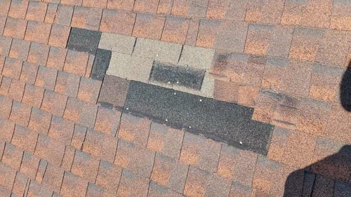 missing shingles on an architectural asphalt shingle roof