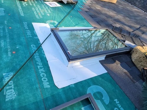 skylight replaced on an asphalt shingle roof