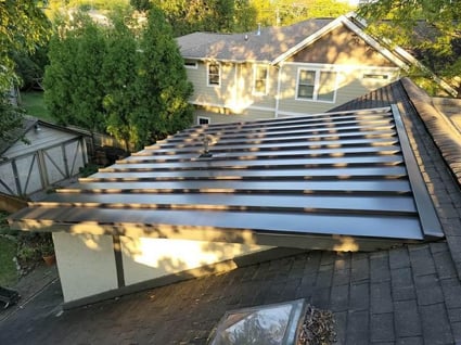 metal roof over a flat roof