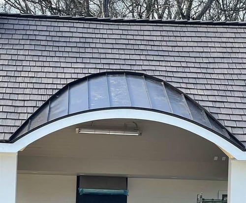 standing seam metal roof over arch