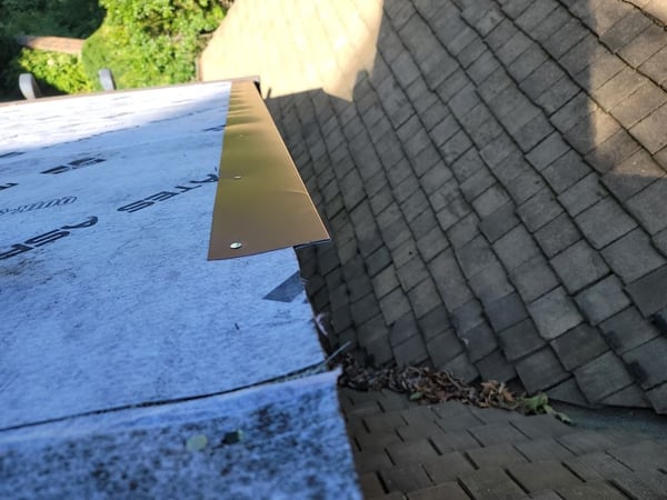 lock strip on the rake before installing standing seam metal roof panels