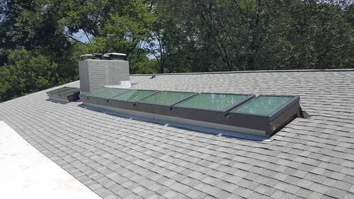 skylights installed on an architectural asphalt shingle roof