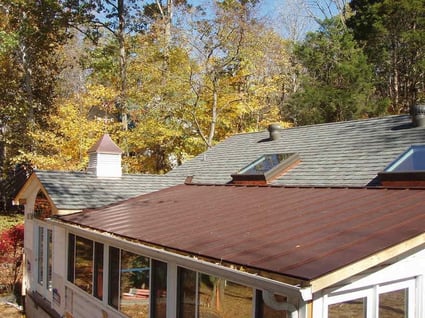 standing seam metal roof porch with asphalt shingles
